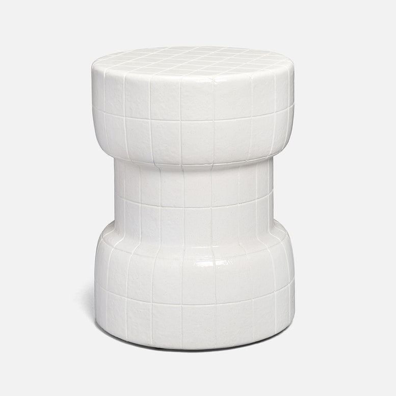A modern white concrete side stool with a textured grid pattern, shown against a light gray background.