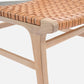 Wooden bench with woven seat on a white background