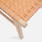 Close-up of a woven chair seat with wooden legs on a white background