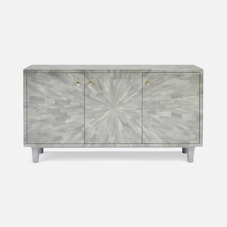 A modern three-door sideboard cabinet featuring a light gray and white fish-scale or bone inlay pattern with a sunburst design on the center door, small gold knobs, and tapered light gray legs, shown against a plain light gray background.