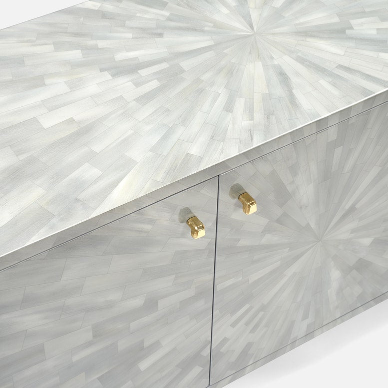 A modern sideboard cabinet featuring a light gray and white geometric mosaic inlay pattern on the doors and top, accented with two gold cabinet handles.