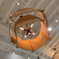 Large decorative chandelier hanging from a ceiling in an indoor setting