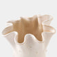 Beige ceramic vase with wavy edges on a white background