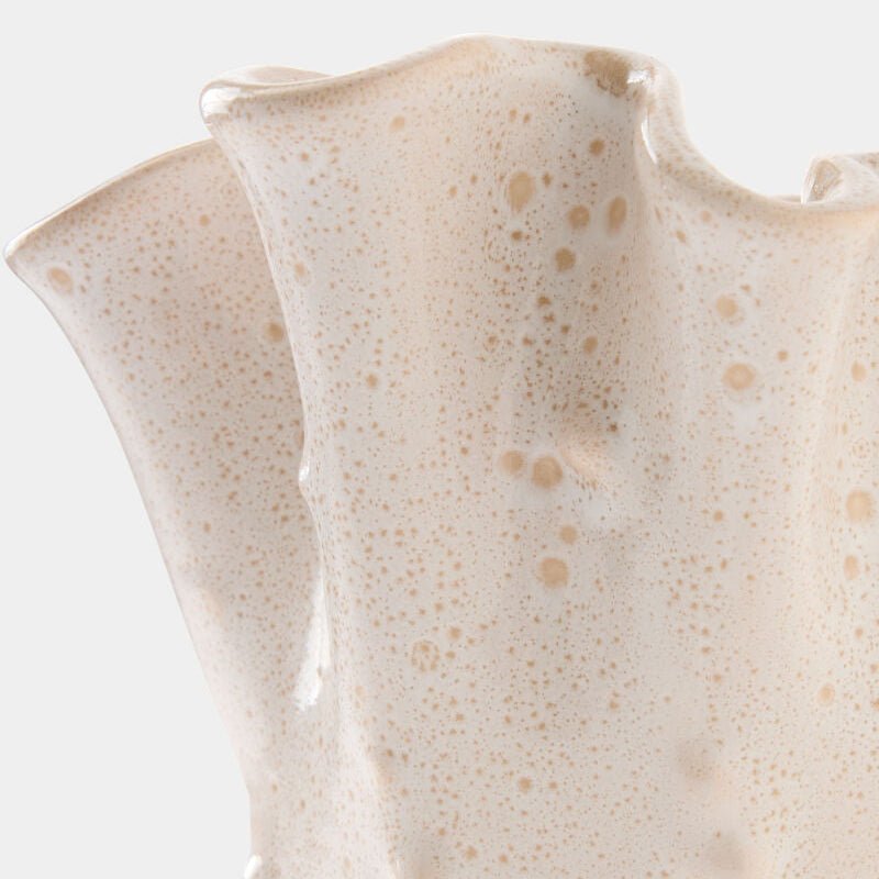 Close-up of a ceramic vase with a textured surface on a white background