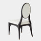 A modern dining chair with a dark wood frame, an oval backrest upholstered in off-white fabric, and a square seat cushion in matching off-white upholstery, shown against a light gray background.
