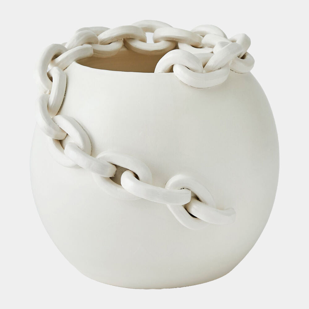 White ceramic vase with chain-like design on a light gray background