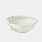 White ceramic bowl with woven design on a white background