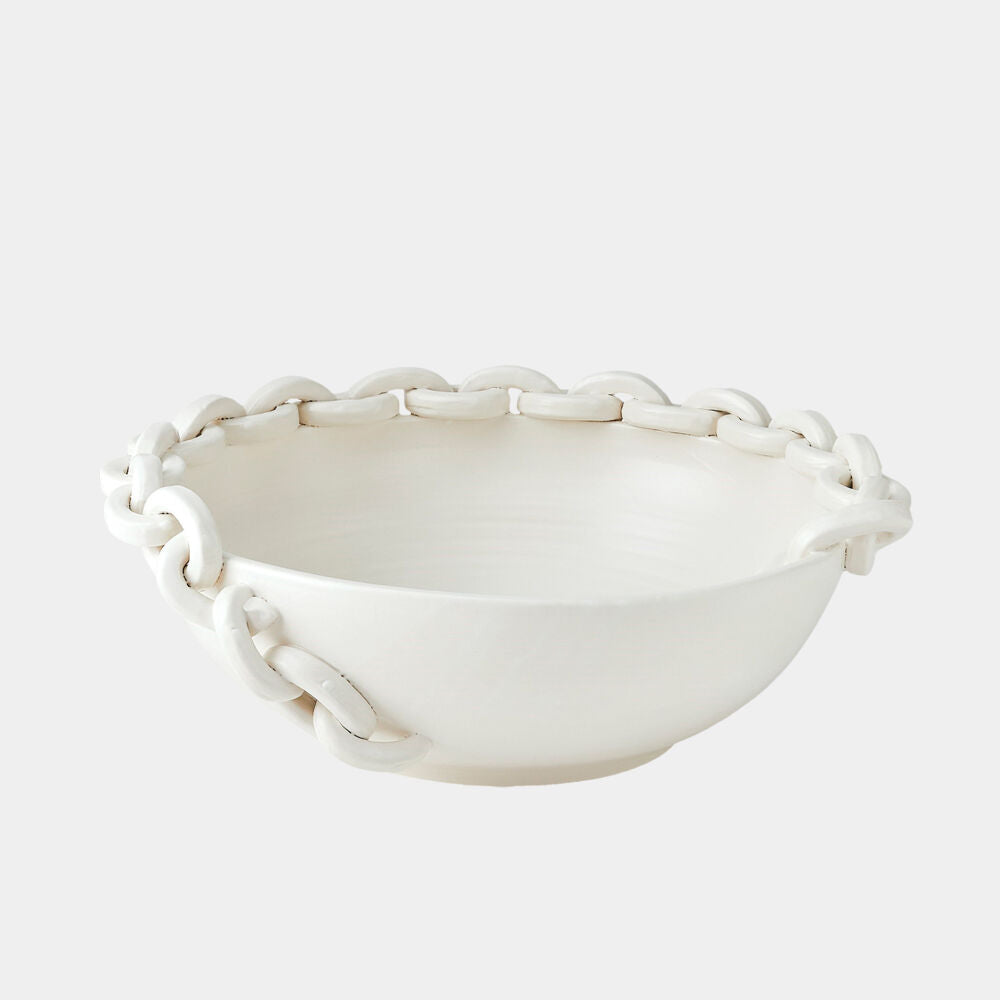 White ceramic bowl with woven design on a white background