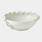 White ceramic bowl with decorative chain-like rim on a white background