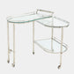 Glass serving cart with metal frame on a white background