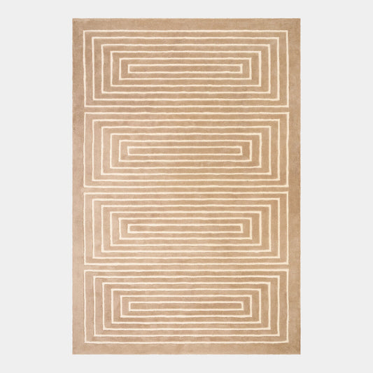 A rectangular area rug with a geometric pattern of concentric rectangles in warm beige and cream, shown flat against a light gray background.