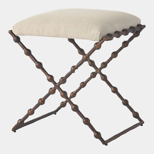 Stool with metal frame and beige cushion on a white background