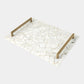 Decorative tray with marble pattern and gold handles on a white background