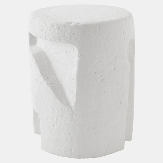 A white textured cylindrical stool with a sculptural, organic shape and recessed details, shown against a light gray background.