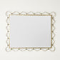 Decorative mirror with gold frame on a white background