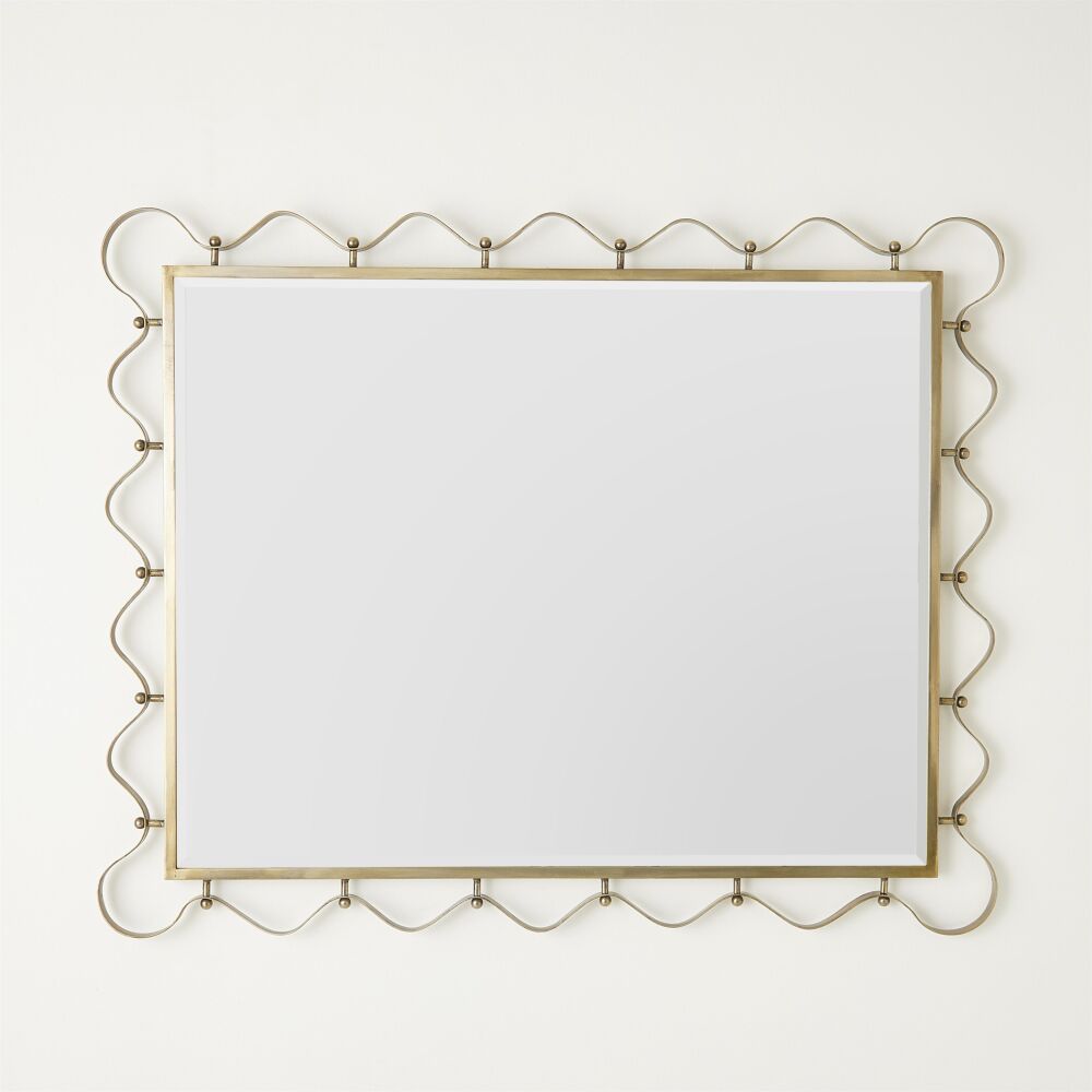 Decorative mirror with gold frame on a white background