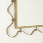 Decorative brass wall hook on a white background