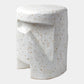 White ceramic stool with textured surface on a white background