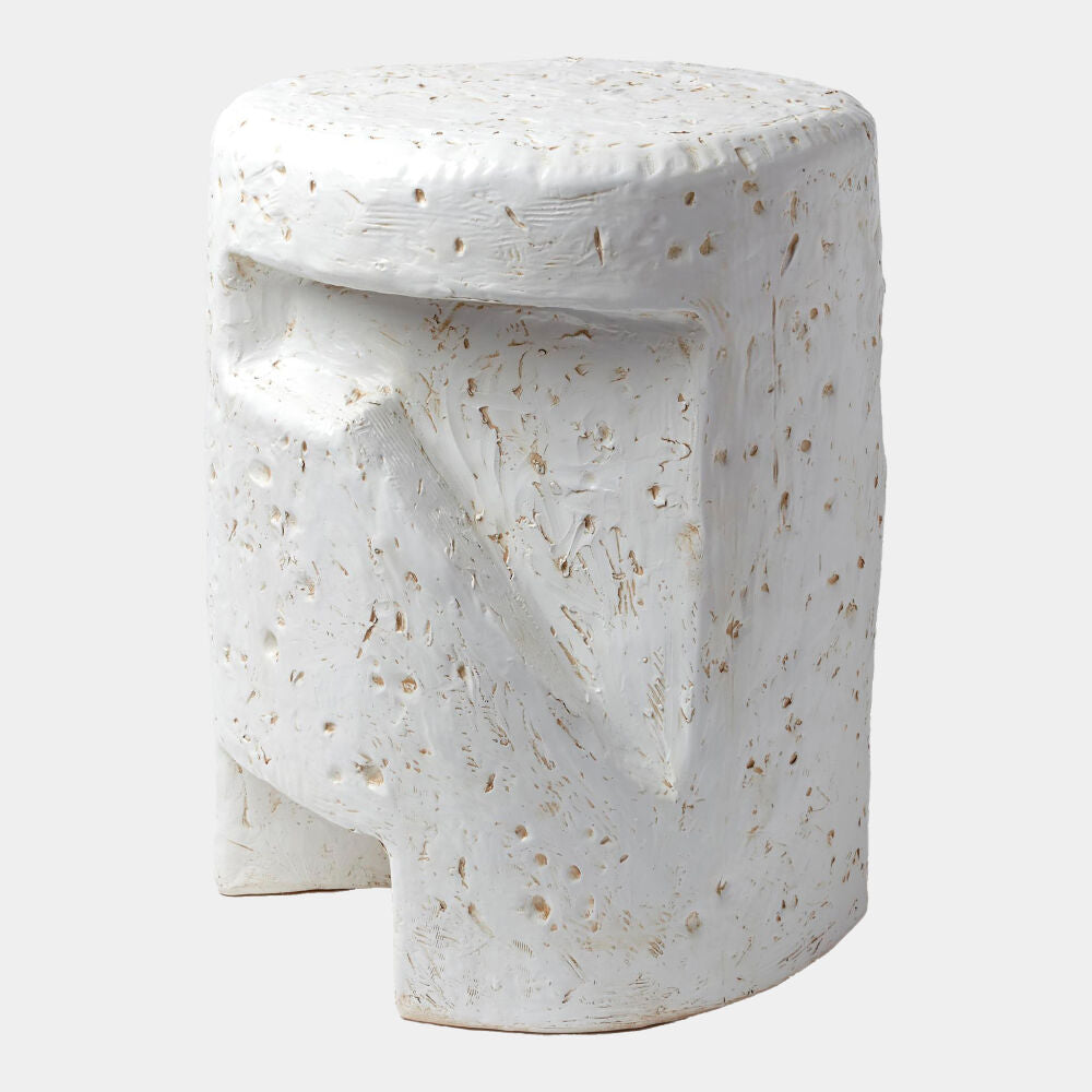 White ceramic stool with textured surface on a white background
