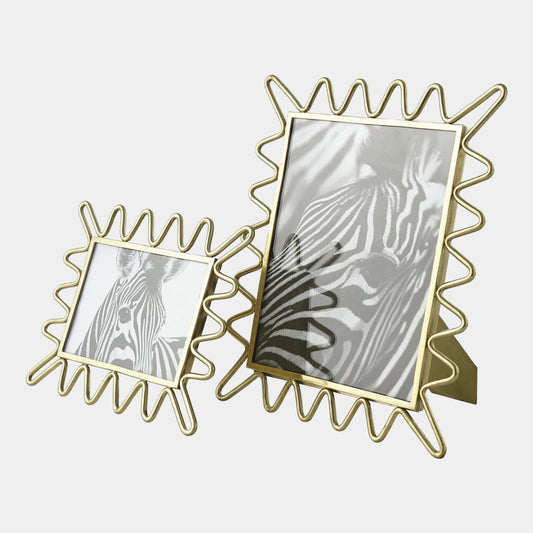 Two gold wire photo frames with zebra prints on a white background