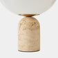Table lamp with a beige terracotta base and white shade on a light gray background