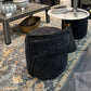 Modern interior design showroom with furniture and decor items.