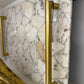 Gold handle on a marble door