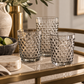 pale gray drinkware on a bar cart