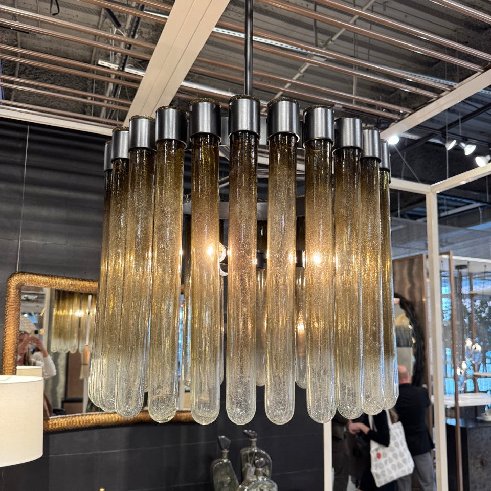Chandelier with glass tubes in a modern interior setting