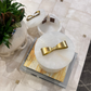 Decorative items with gold bows on a tiled floor