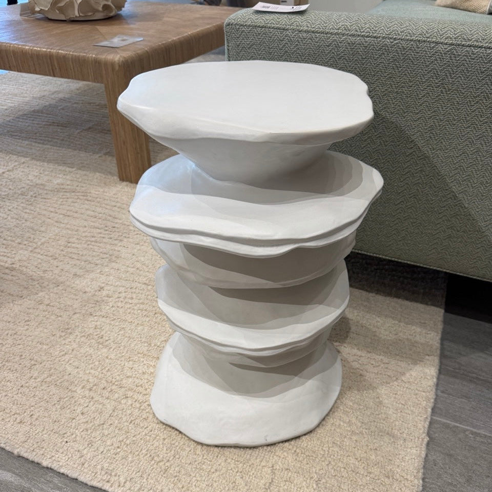 White wavy side table in a living room setting