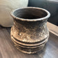 Vintage-style terracotta pot on a wooden surface