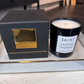 Saint Cajetan candle and packaging on a marble surface