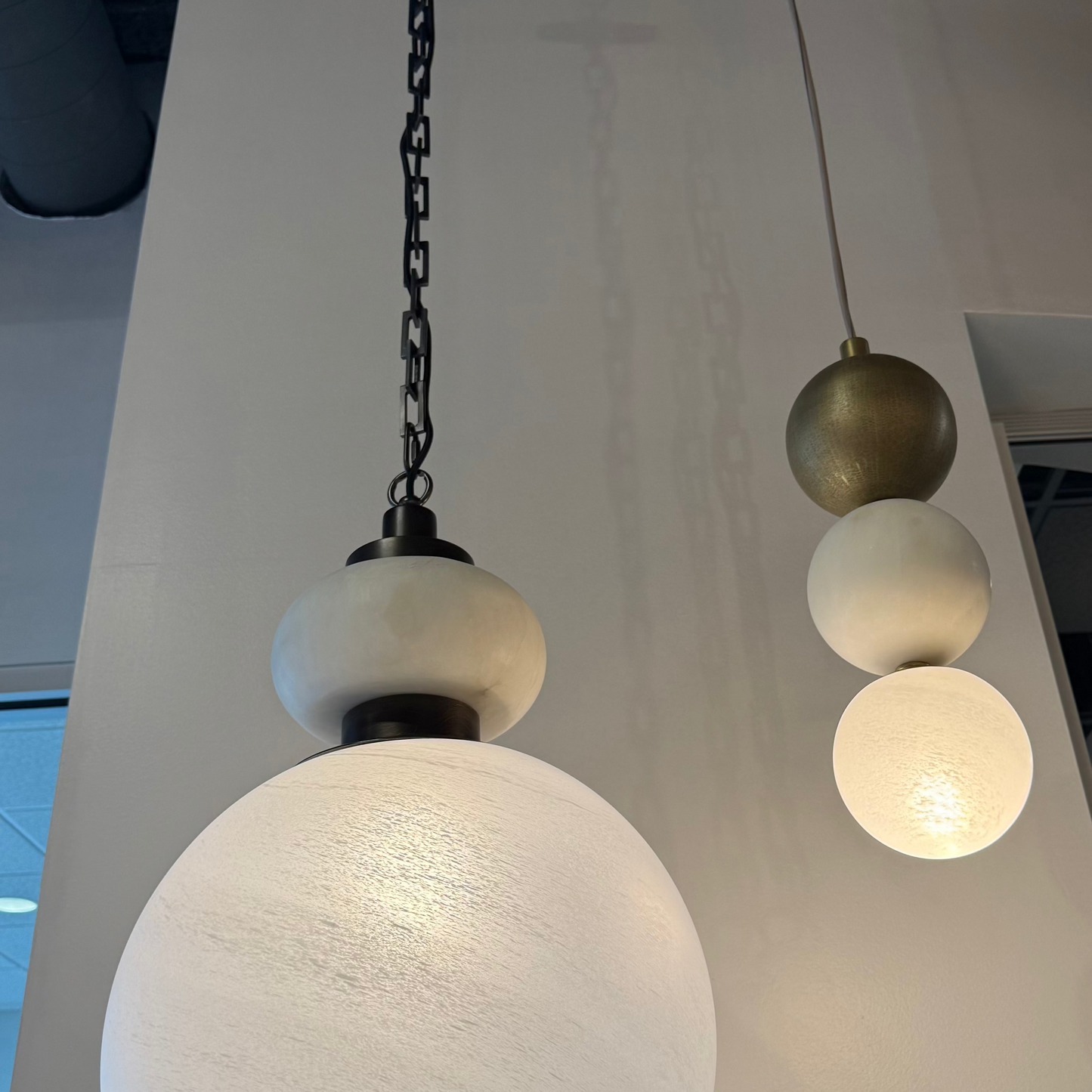 Pendant lights hanging from the ceiling with a neutral background