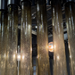 Close-up of textured glass tubes with light reflections
