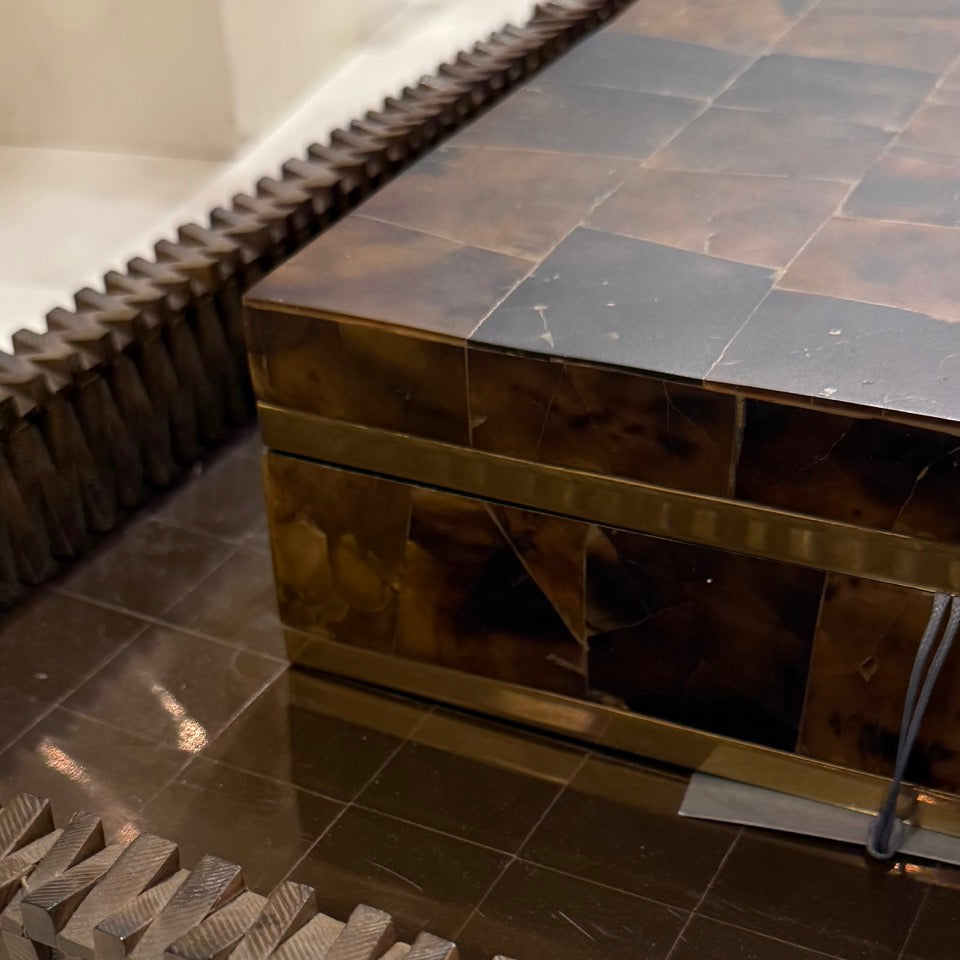 Decorative stone bench with a tiled surface in a modern interior setting