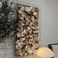 Decorative wall art with stacked stones in a room setting