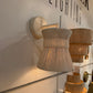 Wooden wall sconces on a white wall with 'GEK Lighting' branding.
