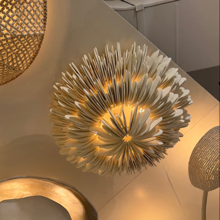 Gold ceiling lights with intricate designs on a ceiling
