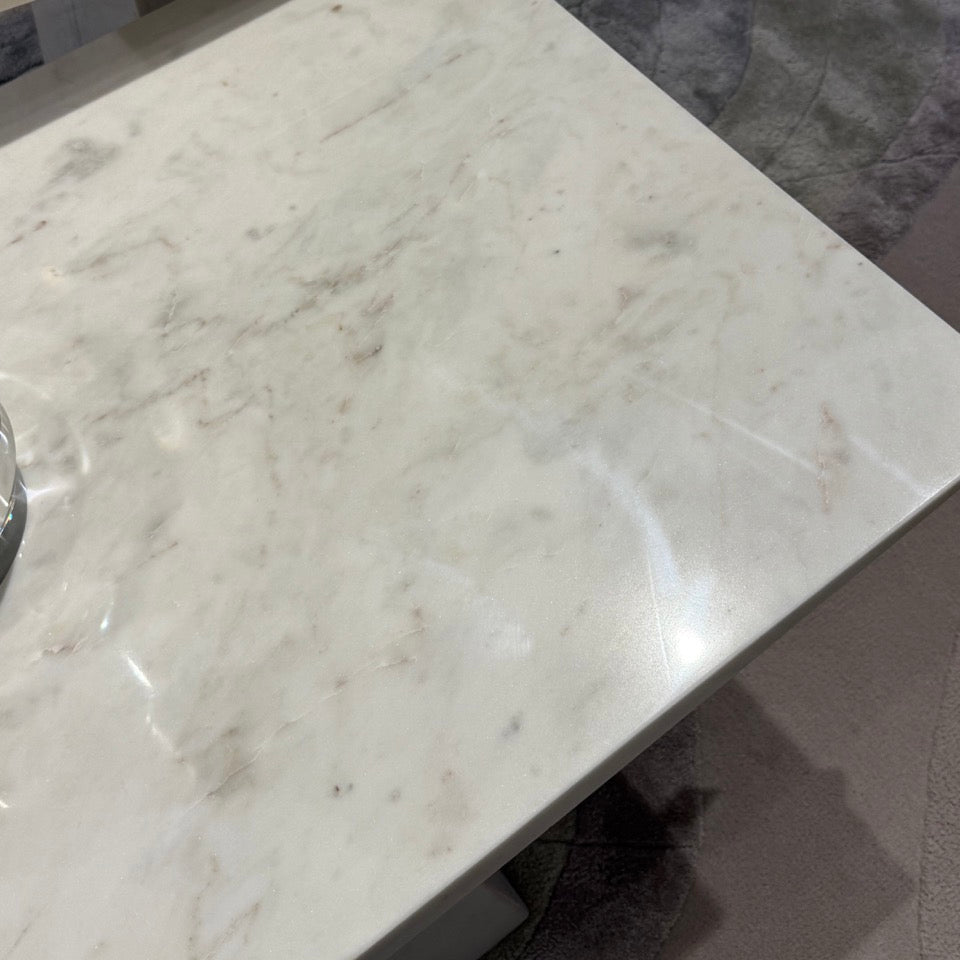 Close-up of a marble countertop with a blurred background