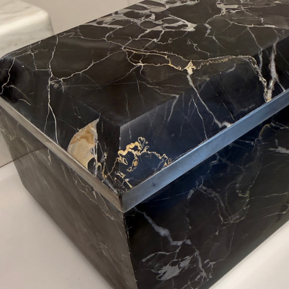 Black marble coffee table on a white surface