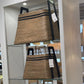 Wicker baskets displayed in a store setting with labels.
