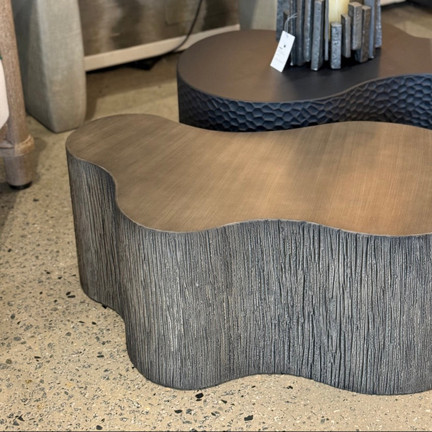 Decorative coffee table with wavy design in a room setting