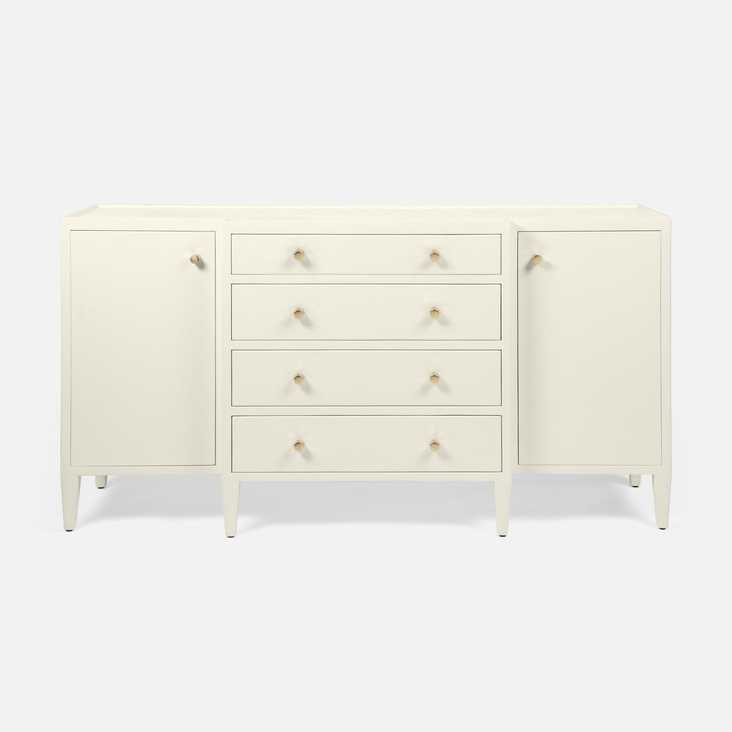 An off-white mid-century modern sideboard with two cabinet doors, four drawers, and small gold knobs, set against a light gray background.