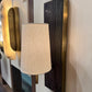 Wall sconces with a lampshade on a white wall