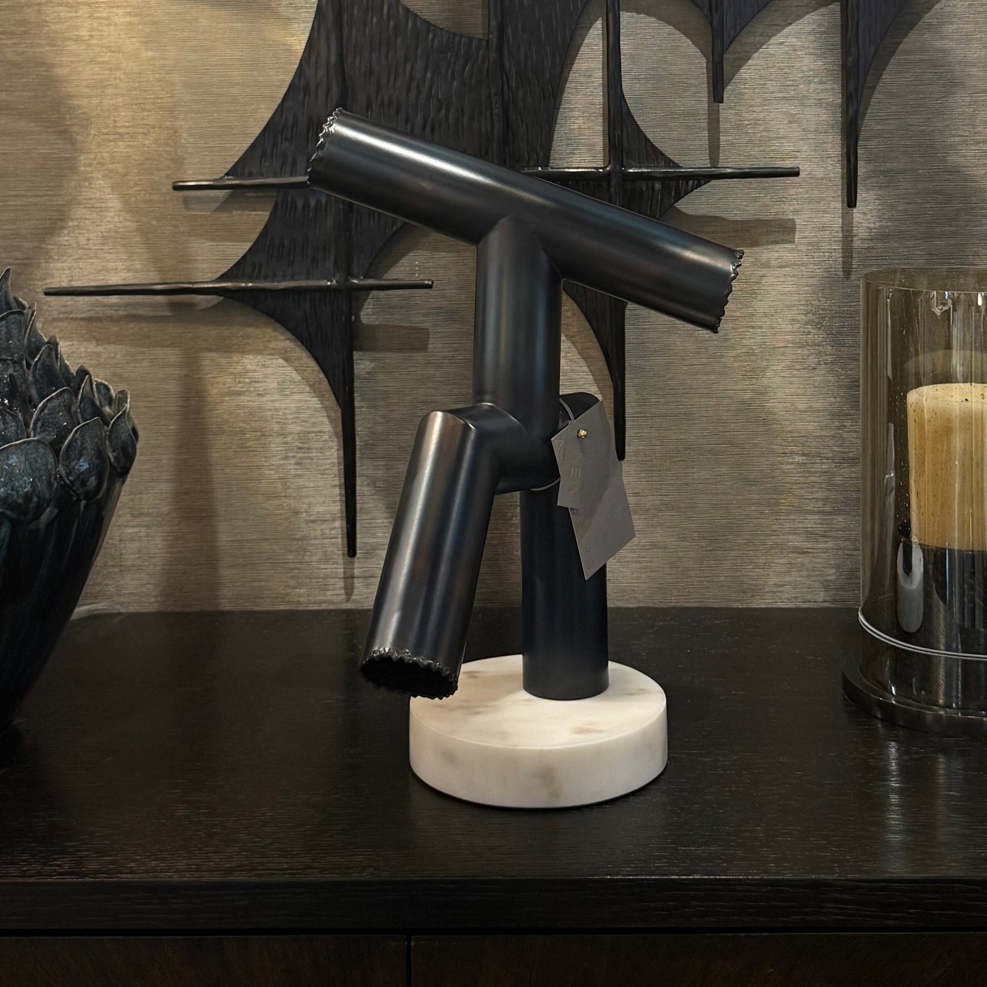 Modern interior design with abstract wall art and furniture.