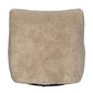 Beige textured cushion on a white background