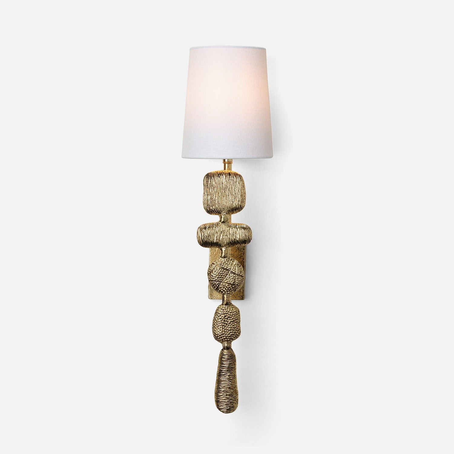 Decorative wall sconce with textured gold base and white shade on a light gray background
