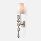 Decorative wall sconce with textured design on a white background
