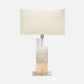 Table lamp with a rectangular base and beige shade on a white background